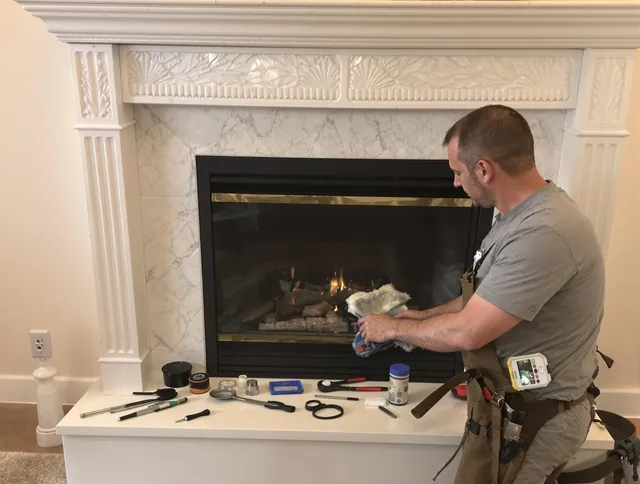 Orange Chimney Sweep performing fireplace maintenance in Orange, CT