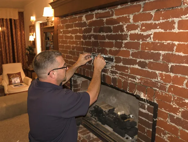 Orange Chimney Sweep expert fixing a fireplace in Orange, CT